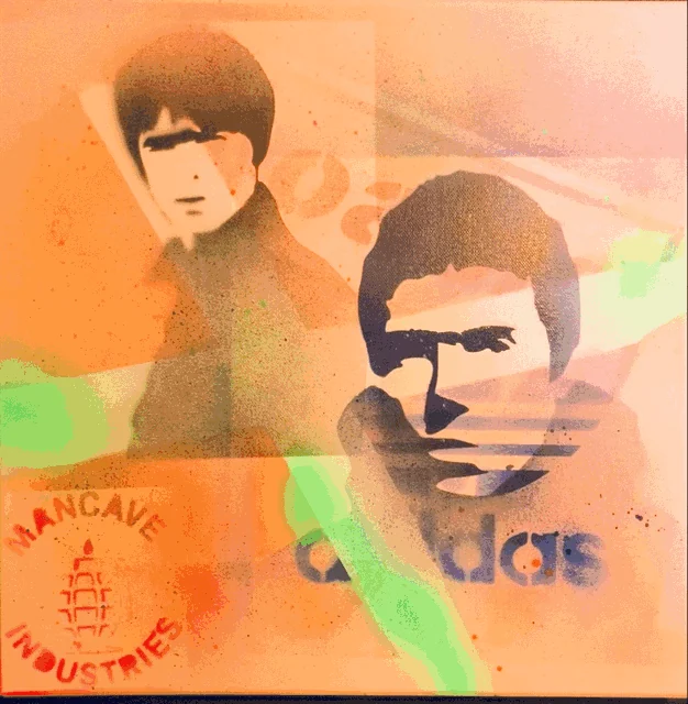Canvas in daylight: two stencilled portraits, with the Mancave Industries seal